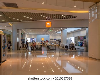 ZHENGZHOU, CHINA - Jul 06, 2021: The Front Of A Retail Shop Of The International Brand Xiaomi In A Chinese Mall With Customers Inside