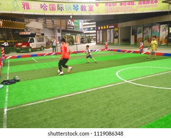 Zhongshan,China-June 23, 2018:boys Playing Soccer Inside A Shopping Mall In A Indoor Soccer Field.