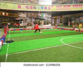 Zhongshan,China-June 23, 2018:boys Playing Soccer Inside A Shopping Mall In A Indoor Soccer Field.