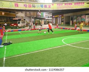 Zhongshan,China-June 23, 2018:boys Playing Soccer Inside A Shopping Mall In A Indoor Soccer Field.