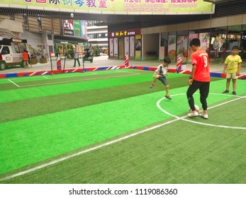 Zhongshan,China-June 23, 2018:boys Playing Soccer Inside A Shopping Mall In A Indoor Soccer Field.