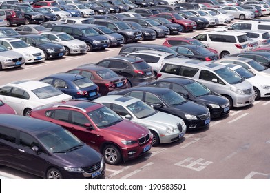 ZHUHAI, CHINA - MAY 2. Rows of the number of cars parked in a public parking lots in the holidays. Zhuhai, May 2, 2014