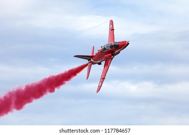 ZHUKOVSKY, RUSSIA - AUG 11: The Celebrating Of The 100 Anniversary Of Russian Air Force. August, 11, 2012 At Zhukovsky, Russia. The Plane Aerobatic Team Red Arrows Royal Air Force Of United Kingdom