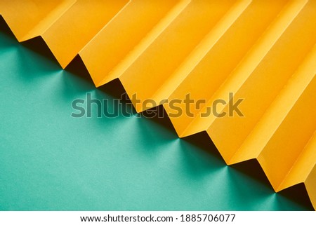 Zig Zag fold paper texture background, Yellow Zigzag paper with blue paper pattern paper background