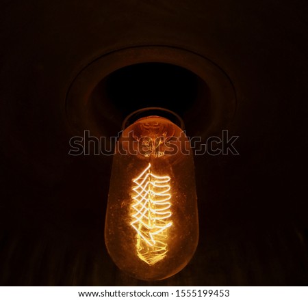 An zig zag view of a vintage light bulb filament where the electricity passed over i,looks crazy in closup..what a vintage mass