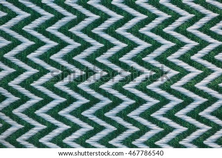 Zig zag of white and green on fabric