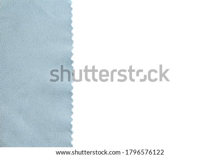 Zigzag cut gray-blue fabric on a white background. copy space