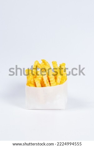 zigzag french fries in white paper packaging and isolated white