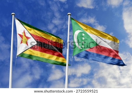 Zimbabwe and Comoros two flags textile cloth, fabric texture, union, peace, conflict and partnership concept. Zimbabwean and Comoran official national relationship symbols.