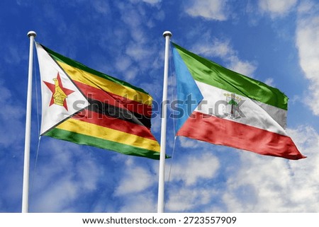 Zimbabwe and Equatorial Guinea two flags textile cloth, fabric texture, union, peace, conflict and partnership concept. Zimbabwean and Equatoguinean official national relationship symbols.