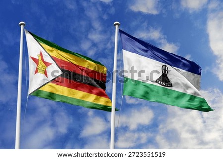 Zimbabwe and Lesotho two flags textile cloth, fabric texture, union, peace, conflict and partnership concept. Zimbabwean and Basotho official national relationship symbols.