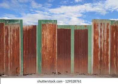 Zinc Fence On Blue Sky Background