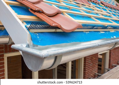 Zinc Gutter And Roof Tiles On New House