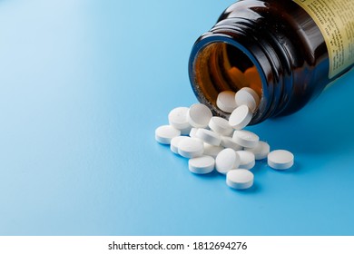 Zinc Tablets, Nutrition Supplement Pills On Blue Background