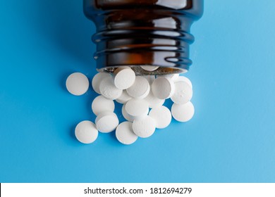 Zinc Tablets, Nutrition Supplement Pills On Blue Background