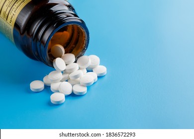 Zinc Tablets, Nutrition Supplement Pills On Blue Background