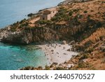 Zingaro Nature Reserve, Sicily, Italy - October 8, 2023: A small cove in Italy with turquoise water, dreamy wild beach in Sicily