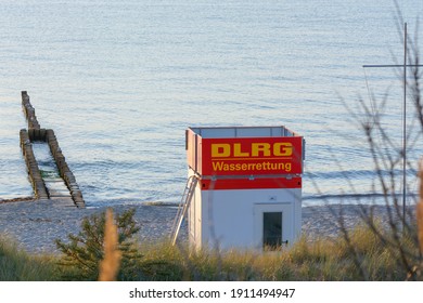 ZINGST, OSTSEE, GERMANY - JULY 29, 2018:

Bay Watchtower On The Beach At High Tide In Front Of A Blue Sky Near Zingst On The Baltic Sea, The Label DLRG - Water Rescue. Means German Life-saving