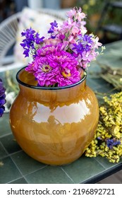 Zinnia Flowers In Vase On Table Outdoors