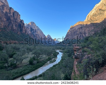 Zion national park- Beautiful stream leading into a mass of large mountains. 