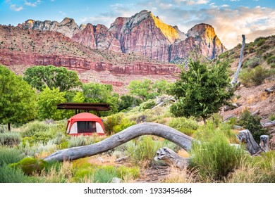 Zion National Park In Utah With Tent Camp Site At Watchman Campground By Rocks, Plants Trees And View Of Cliffs At Sunset