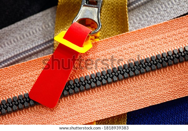 Zip background texture of zippers
sliders. a lot of zippers in different colors. sewing clothes,
atelier, fabric and accessories shop. hobby diy
concept