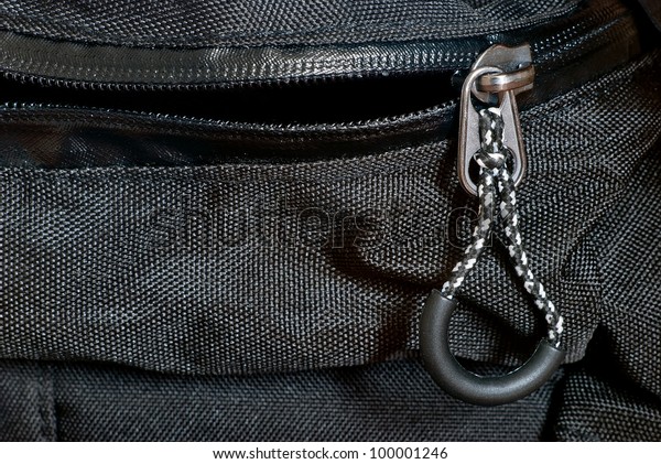 Zipper and buckle on a\
backpack