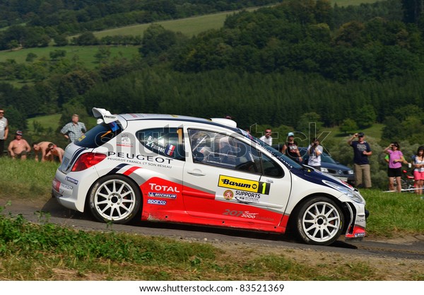 ZLIN,CZECH REP.-AUGUST 27.
Driver Bouffier B.and co-driver Panseri X. with car Peugeot 207
S2000 at Barum Rally event,speed check Nr 6,August 27.2011 in
Zlin,Czech republic
