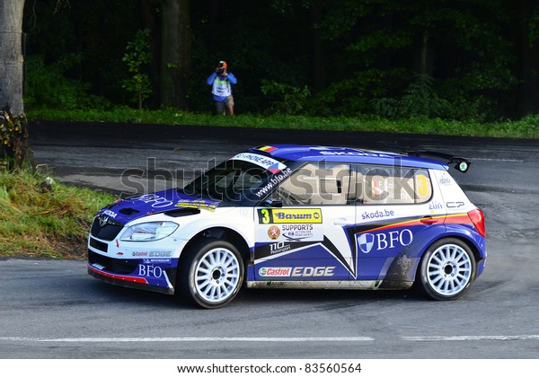 ZLIN,CZECH REP.-AUGUST 28.\
Driver Loix F..and co-driver Miclotte Fwith car Skoda Fabia S2000\
at Barum Rally event,speed check Nr 13.August 28.2011 in Zlin,Czech\
republic