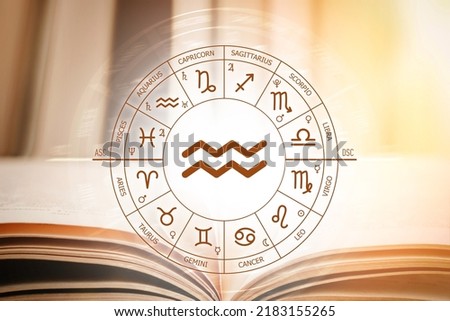 Zodiac circle against the background of an open book with aquarius sign. Astrological forecast for the signs of the zodiac. Characteristics of the sign aquarius. Astrology, esotericism, secret science