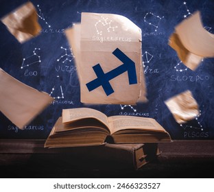 Zodiac sign sagittarius on old paper flying above old astrology books. - Powered by Shutterstock