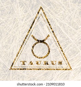zodiac sign of taurus in a triangle, the element of earth in the horoscope, the sign of taurus on the background of hay.
