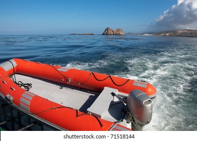 Zodiac Skiff suspended at back of larger boat