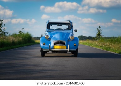 ZOETERMEER, NETHERLANDS - Jul 15, 2021: A Blue Citroen 2CV (Deux Chevaux) classic car on the road