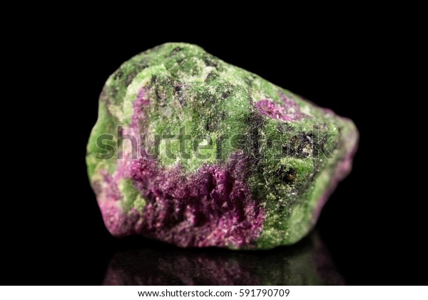 Zoisite and ruby Gemstone, black background,\
mineral stone, healing