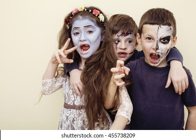 Zombie Apocalypse Kids Concept. Birthday Party Celebration Facepaint On Children Dead Bride, Scar Face, Skeleton Together