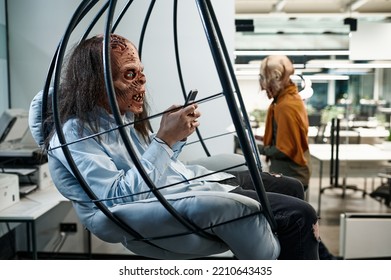 Zombie Employee Chatting Social Network In Office Lounge Area