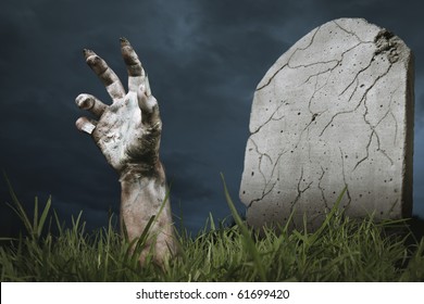 zombie hand coming out of his grave