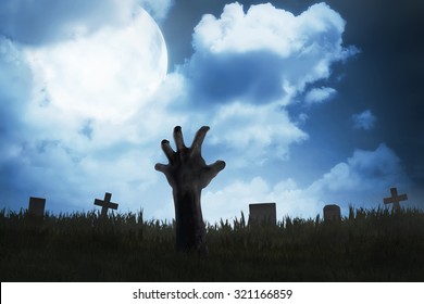 Zombie hand out from the graveyard. Halloween concept