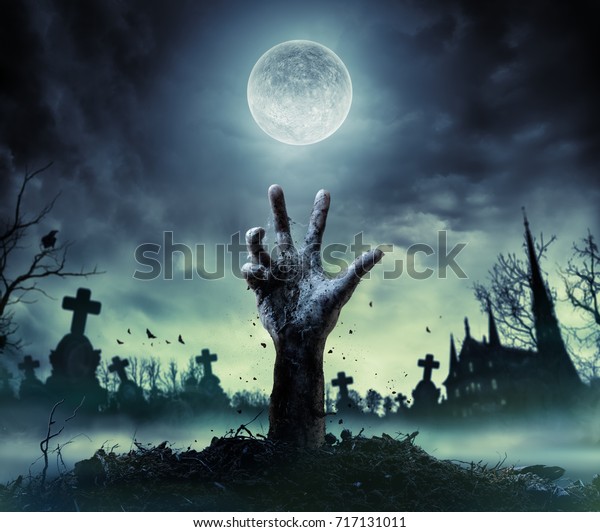 Zombie Hand Rising Out Of A\
Grave\
