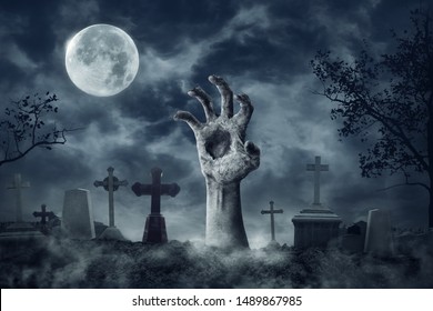 Zombie Hand Rising Out Of A Graveyard cemetery In Spooky dark Night full moon. Holiday event halloween concept. - Shutterstock ID 1489867985