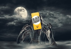 Zombie Hands Coming Out Of The Ground, One Is Holding A Smartphone With Black Friday Online Shopping Ad