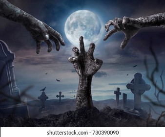 Zombie hands rising in dark Halloween night.