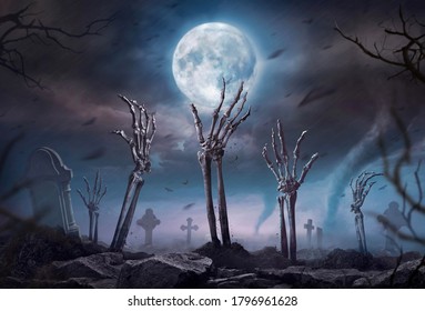 Zombie skeleton hand rising in dark Halloween night. 