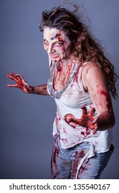 Zombie woman  with yellow eyes looking at camera