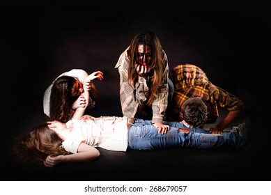 Zombies Eating Isolated In Dark Background