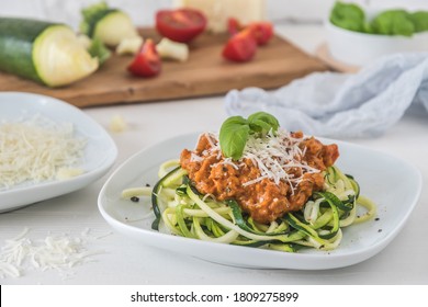 Zoodles Bolognese: Zucchini Noodles With Meat Or Vegan Soy Meat Sauce And Parmesan. For Low Carb, Keto, Paleo Nutrition. 