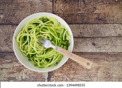 Zoodles (zucchini Noodles) In A Bowl On Wooden Background