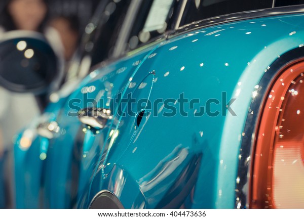 Zoom at car fuel tank cover and\
fender in Car show event at Bangkok, Thailand. This a open event no\
need press credentials required. , process in vintage\
style