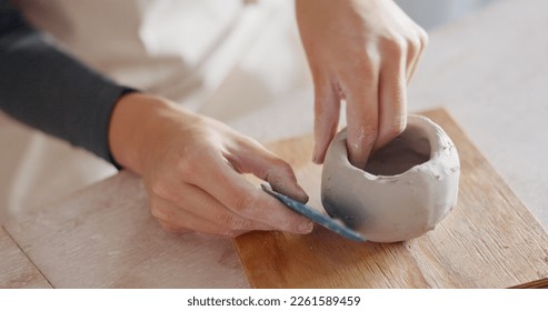 Zoom of creative clay pottery hands with ceramic mold workshop for art, sculpting or manufacturing design class. Learning, startup or working with ceramics or hand craft in studio or small business - Powered by Shutterstock